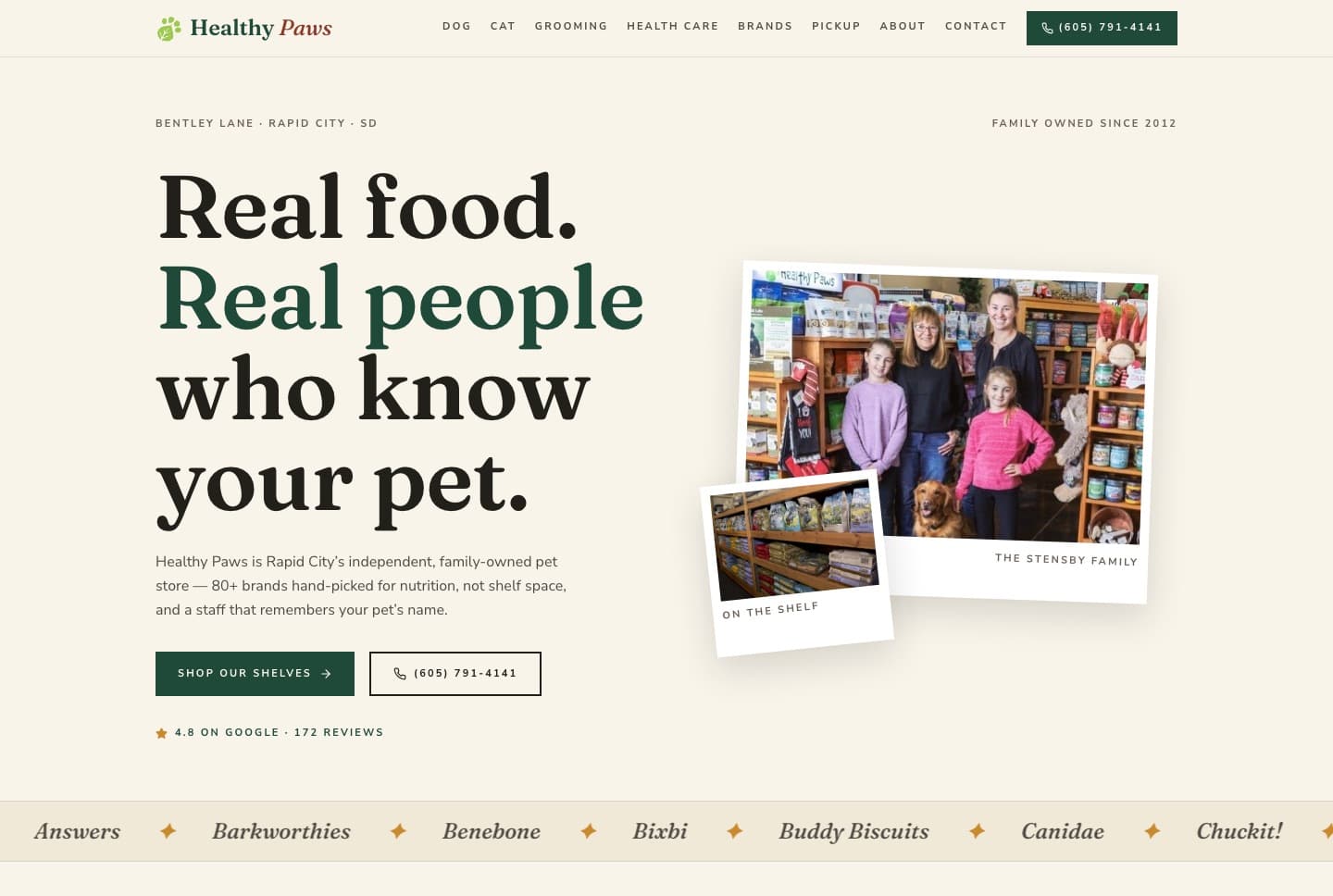 Healthy Paws website: cream page with the headline Real food, real people who know your pet, beside photos of the family who own the store.
